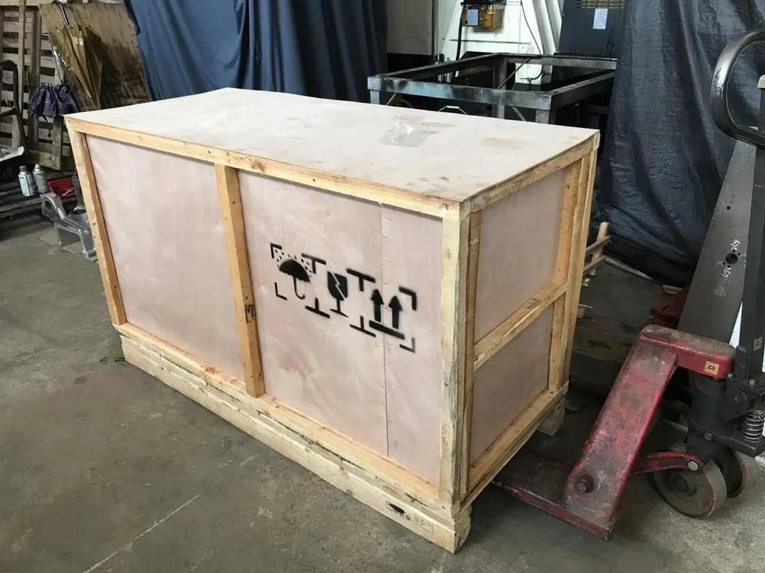 Capsule polishing machine packed in shipping crate