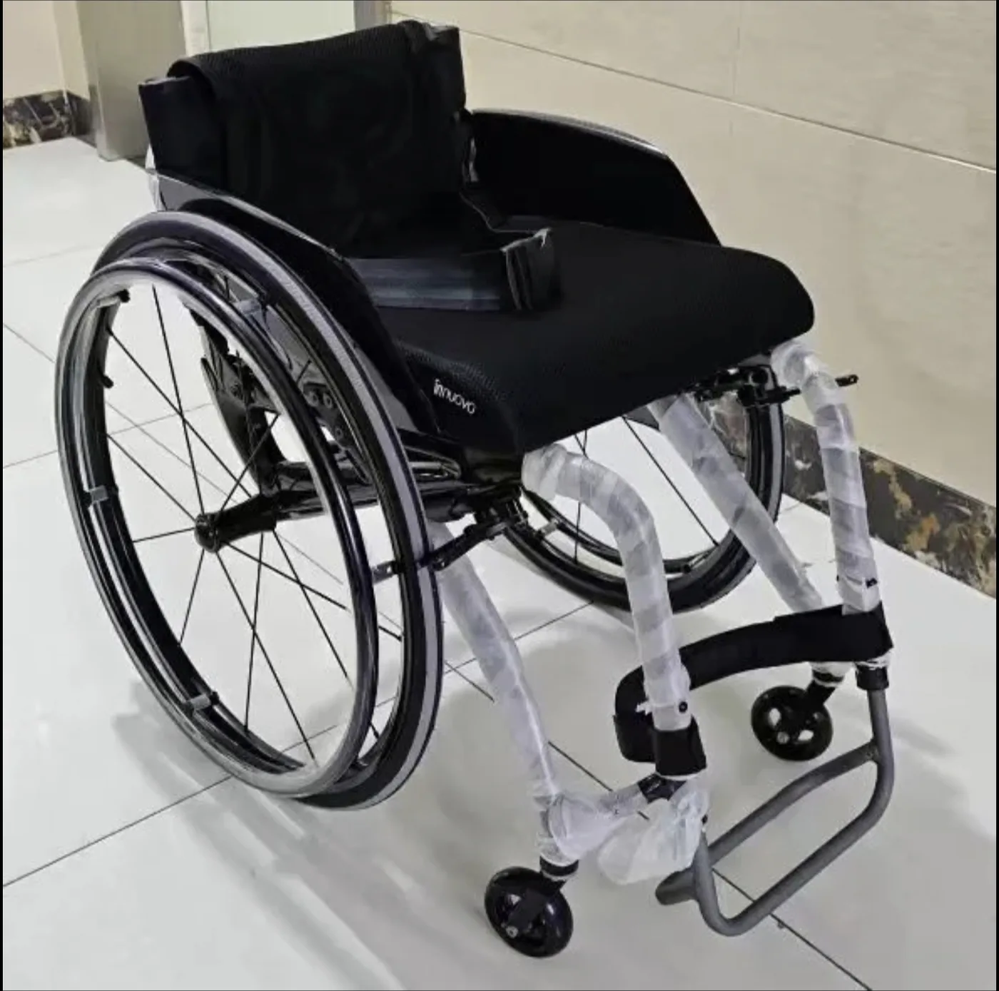 Carbon fibre manual wheelchair seat and breathable memory-foam cushion, side view