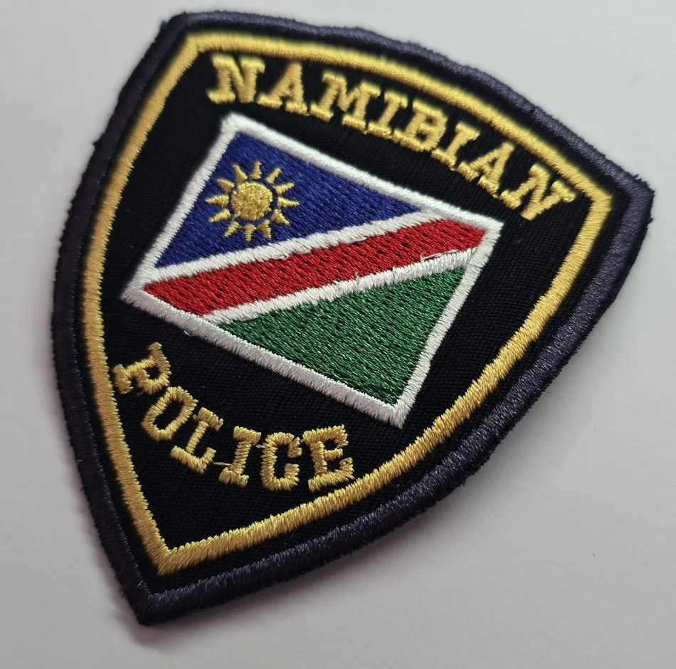Small embroidered patch showing raised satin-stitch detail and colour matching