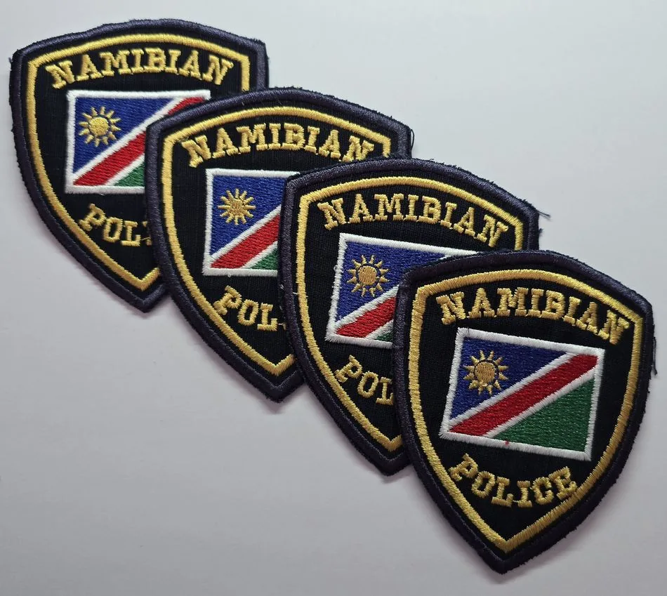 Bulk run of matching embroidered patches with consistent stitching and colour