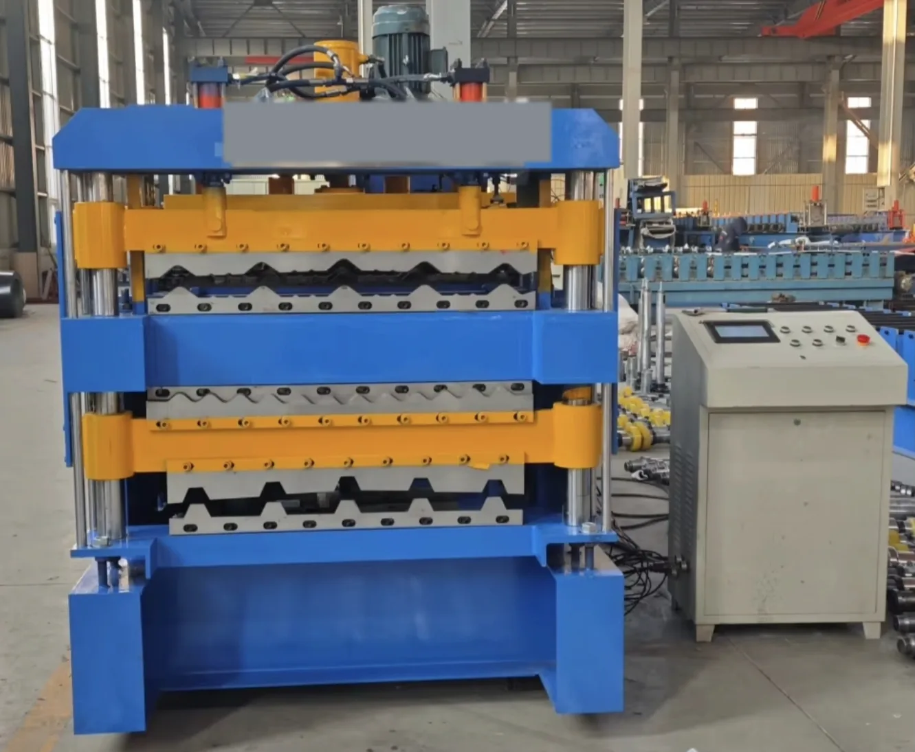 Three layer roof sheet roll forming machine front view with Delta PLC touch-screen control cabinet
