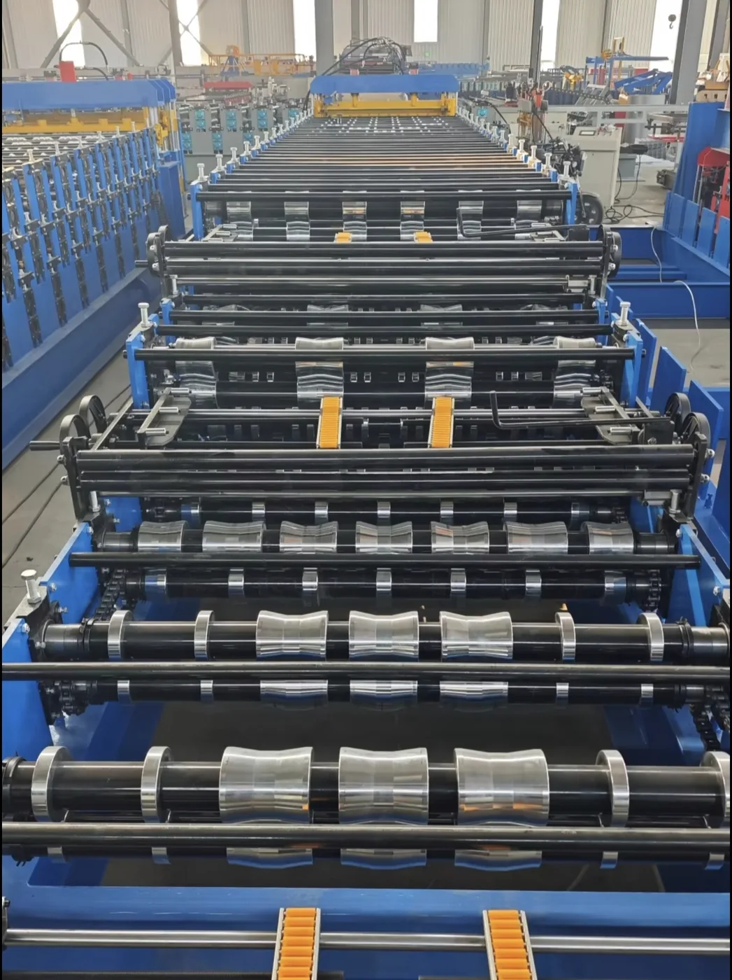 Hard chrome plated forged steel forming rollers inside the roof sheet roll forming machine